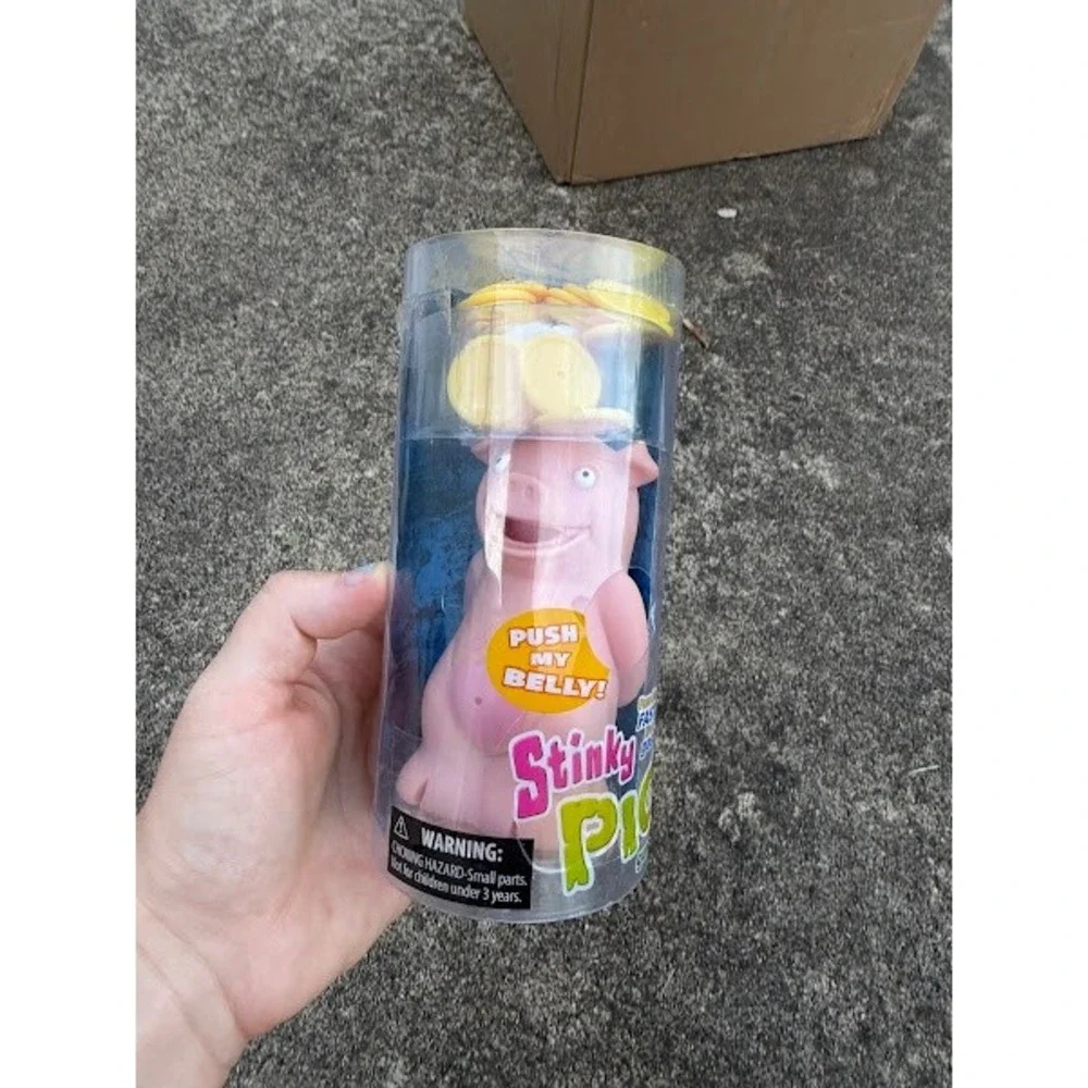 PlayMonster Stinky Pig Game Fast Paced Musical Passing Game for Kids and Family